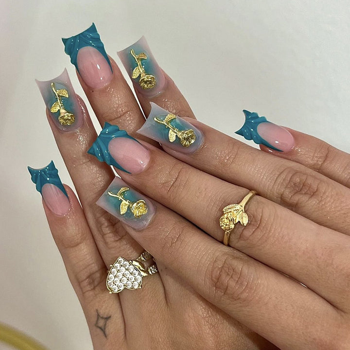 Elegant artificial nail creations with golden embellishments Kalsten