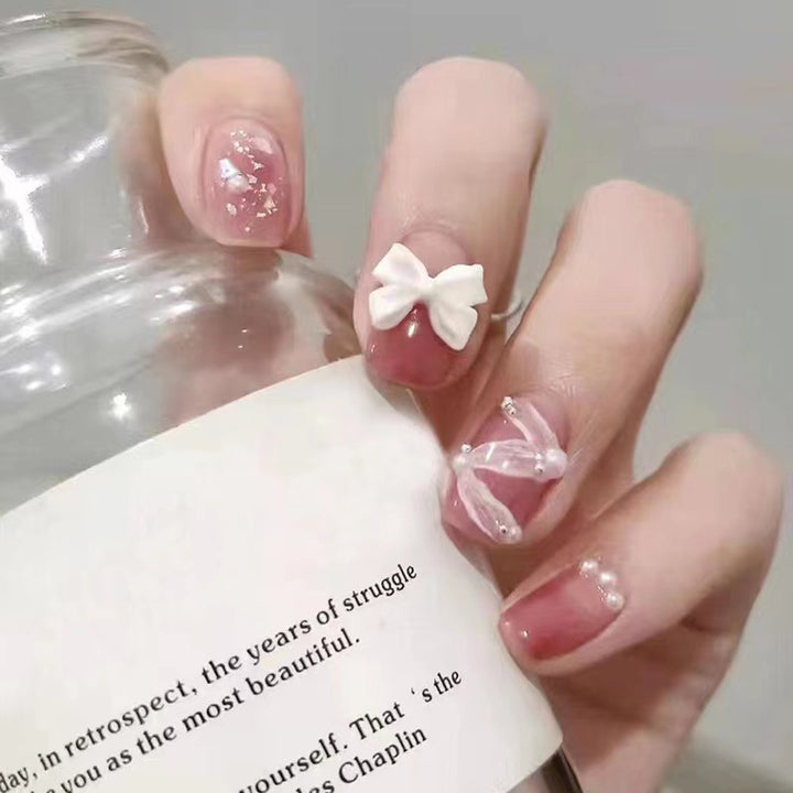 Creative art nails with bows and pearl coating Kalsten