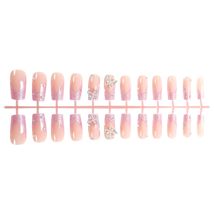 Acrylic nail set with sparkling glitter accents and elegant butterfly motifs Kalsten