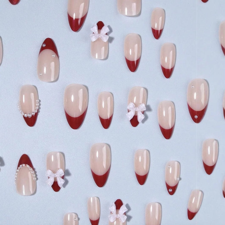 Artificial nail set with glamorous rhinestone and bow decorations Kalsten