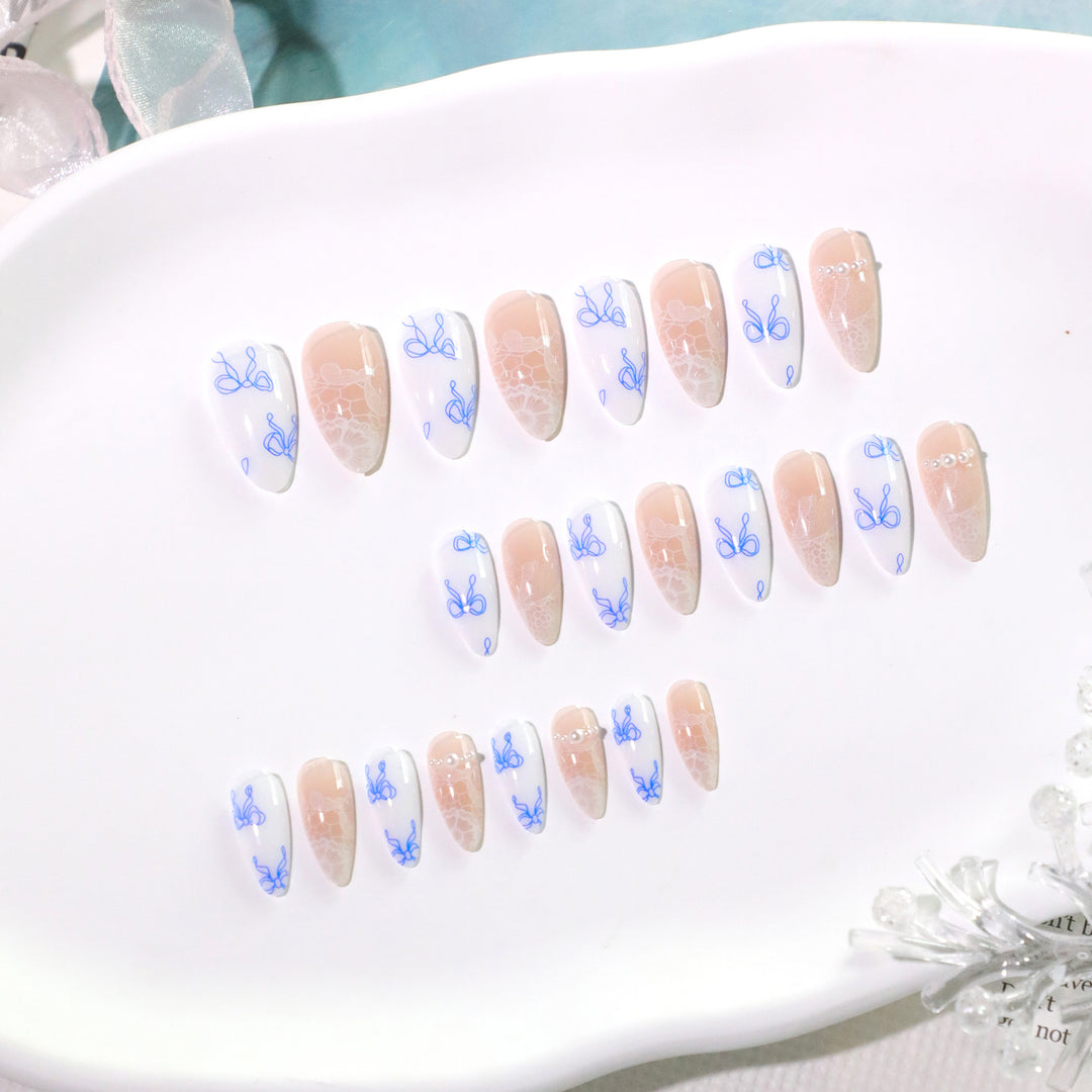 Artistic stiletto nails with delicate bow decorations Kalsten