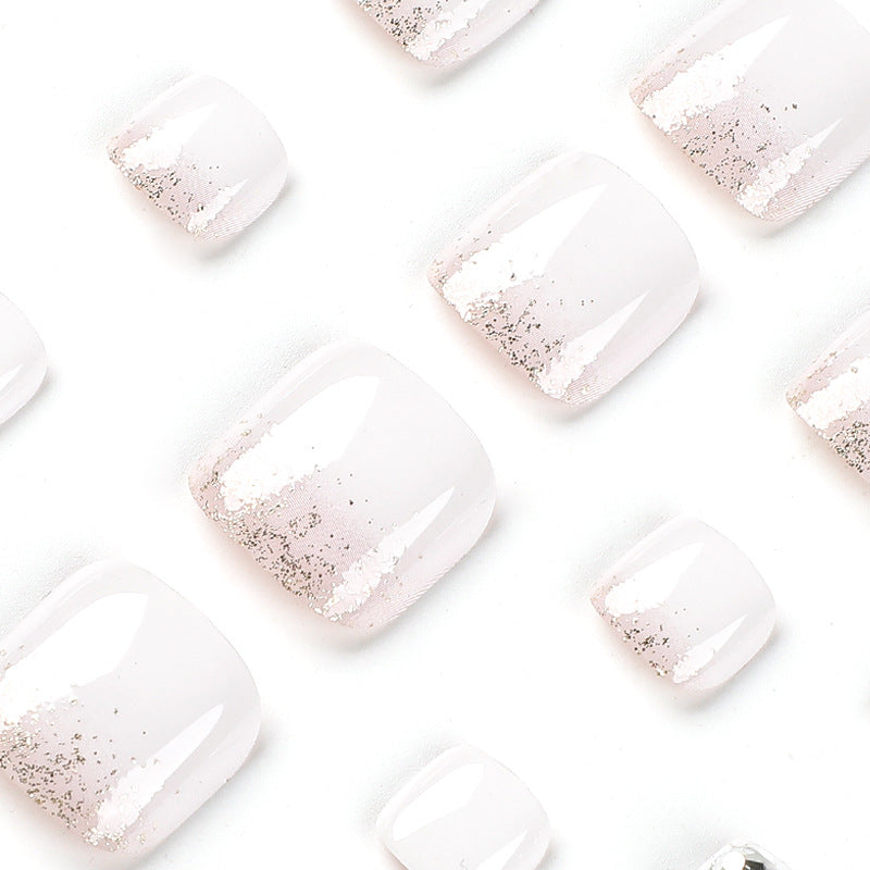 Artful toenail design with sparkling embellishments Kalsten