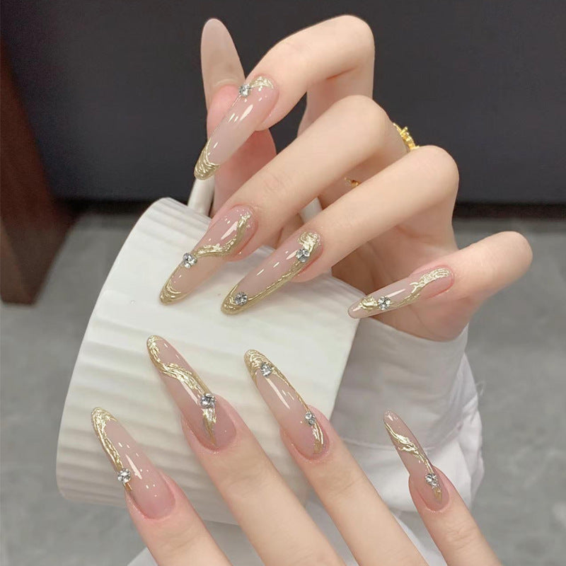 Artificial nail set with elegant gold design and sparkling applications Kalsten
