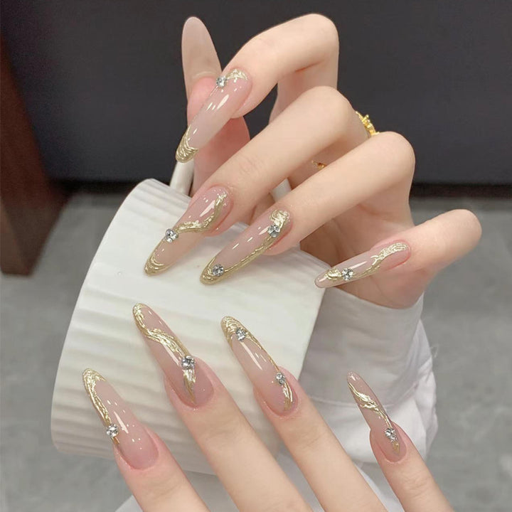Artificial nail set with elegant gold design and sparkling applications Kalsten