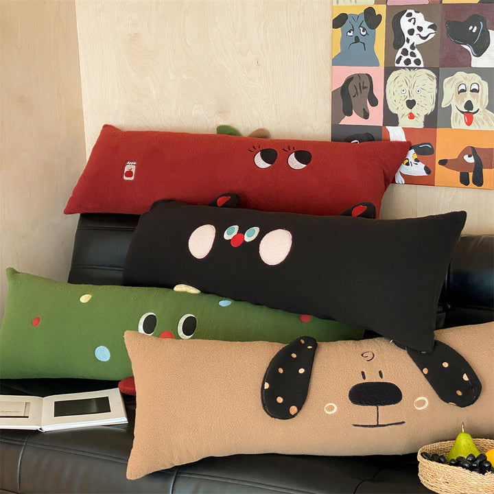 Extra-long plush sofa cushion with appliqués and plush feet