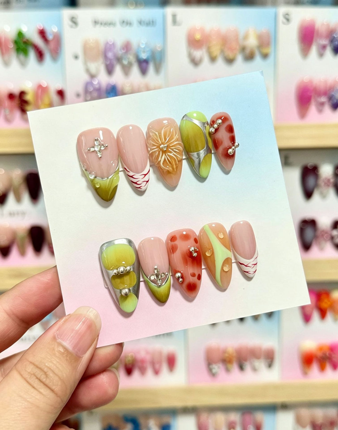 Artistic Press-On Nail Set with Floral and Green Accents