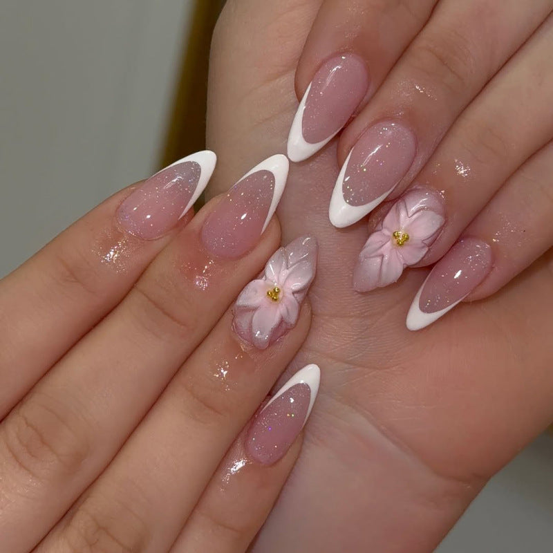 Artistic French-Tip Nail Extensions with Flower Accents Kalsten