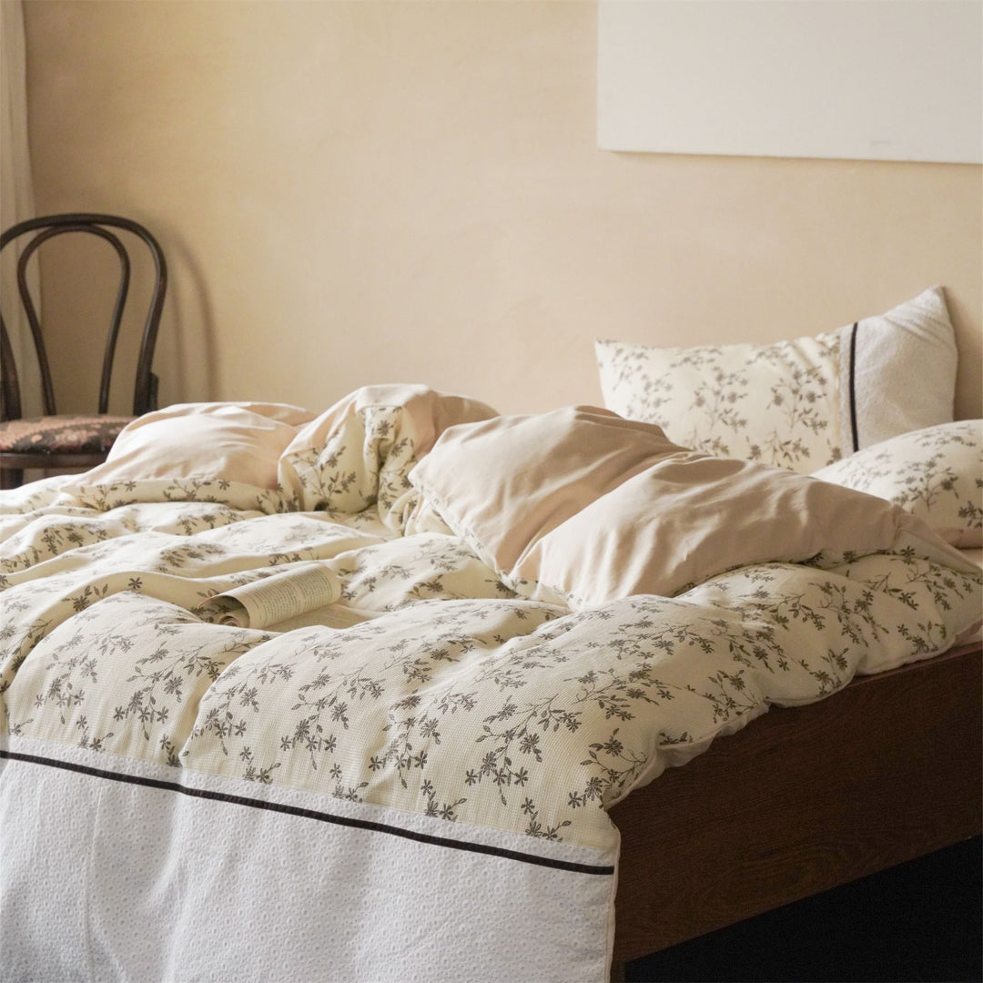 Cotton bedding set with waffle structure, fine floral print and decorative ribbon