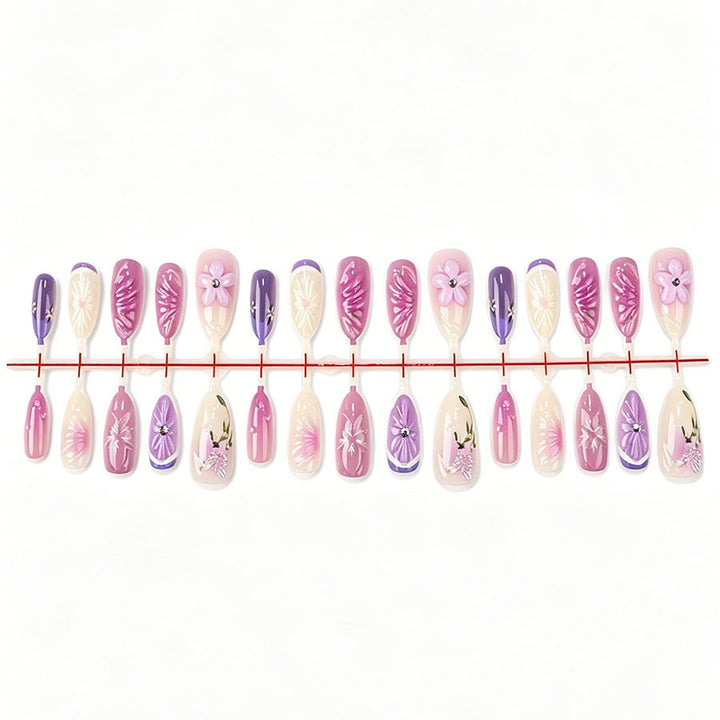 Decorative artificial nails with floral designs and glitter accents Kalsten