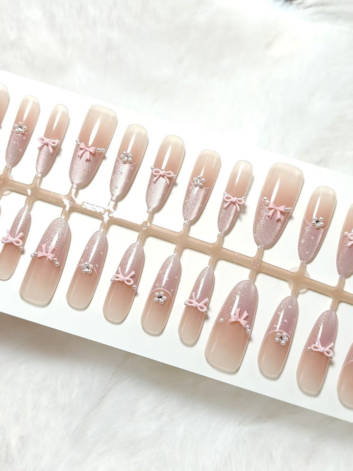 Artificial nails with elegant glitter and bow design Kalsten