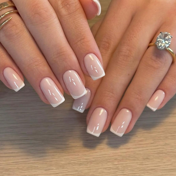 Classic nail extensions with elegant French tips Kalsten