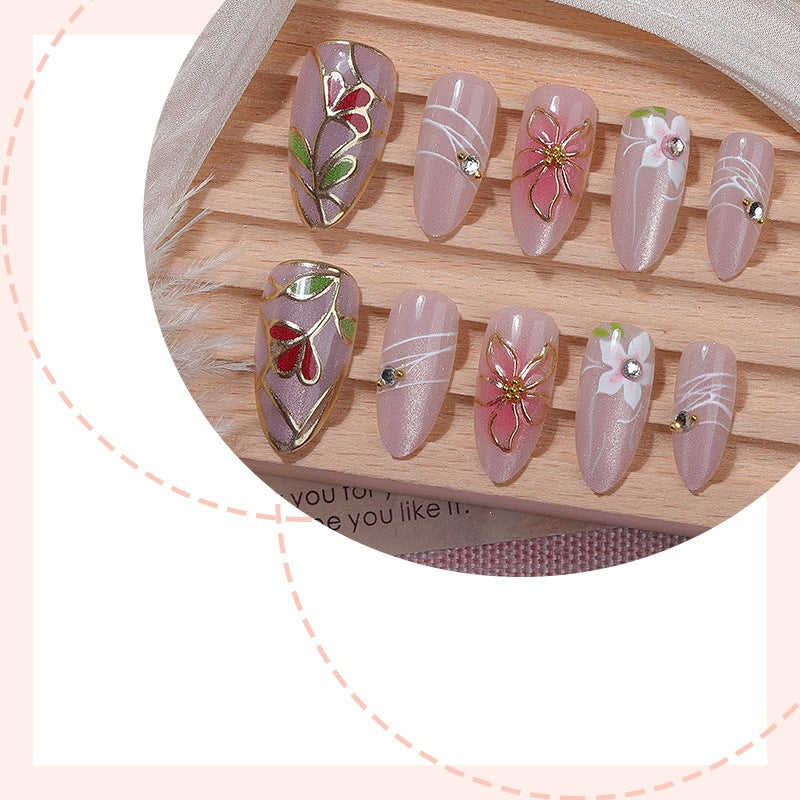 Nail art set with filigree floral decorations and shiny details Kalsten