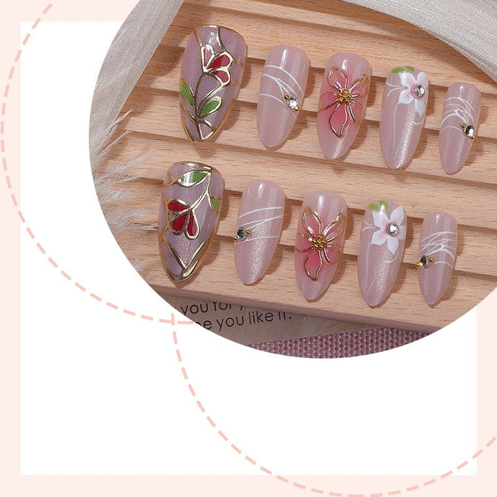 Nail art set with filigree floral decorations and shiny details Kalsten