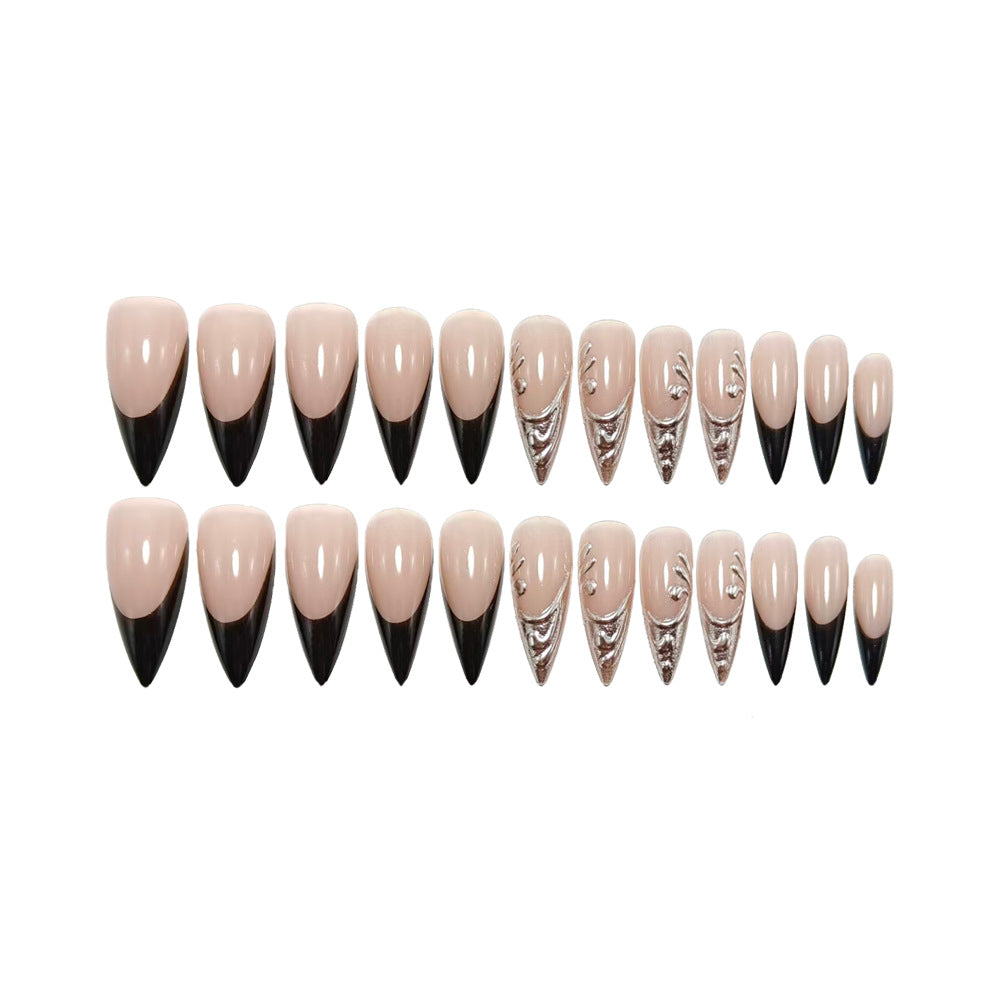 Artificial nails in elegant stiletto style with elaborate metal decoration Kalsten