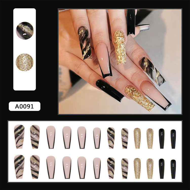 Acrylic nail set with luxurious golden accents and elegant designs Kalsten