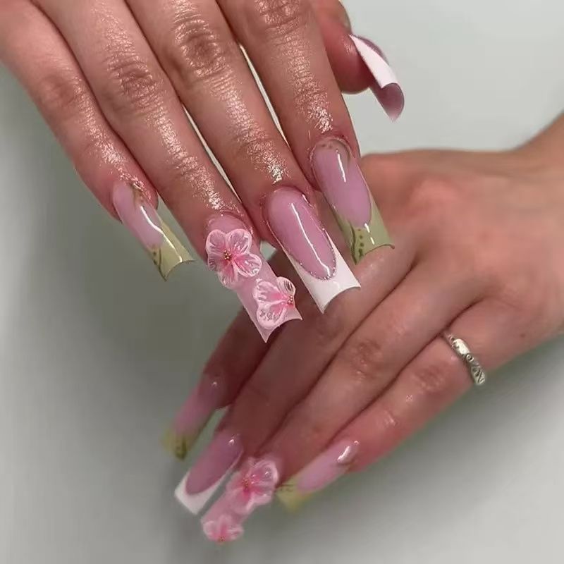 Artful nail tips with floral embellishments Kalsten