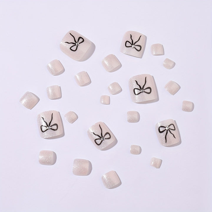 Acrylic nail set with sparkling accents and elegant bows Kalsten
