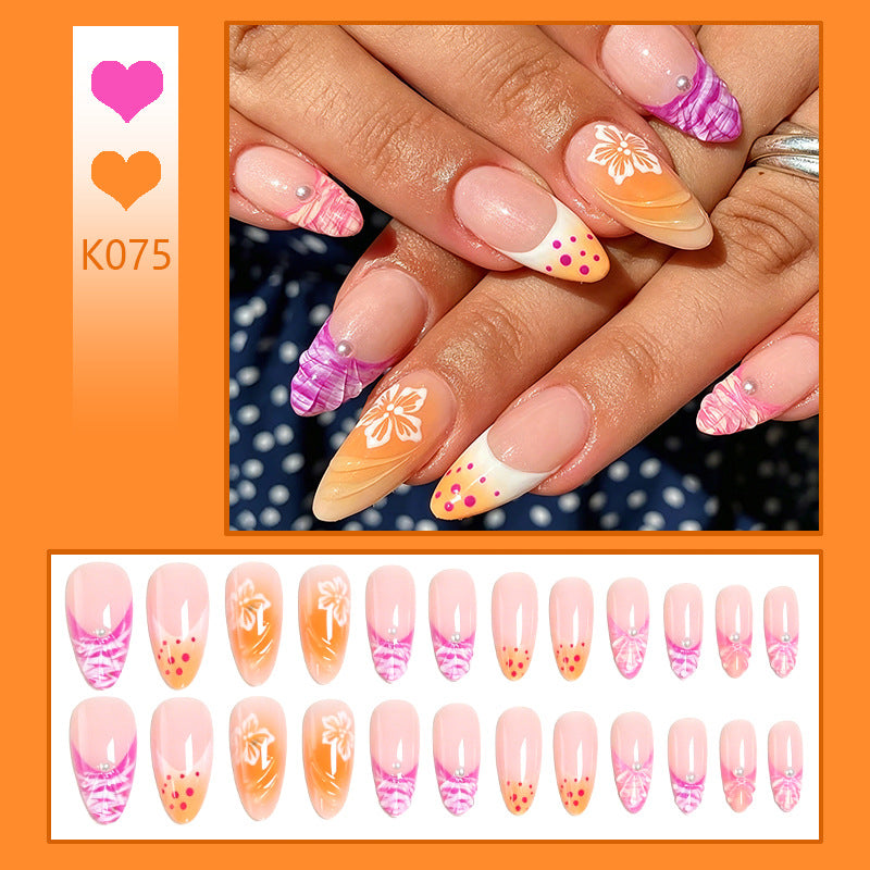 Acrylic nail set with exotic flower patterns and glitter accents Kalsten
