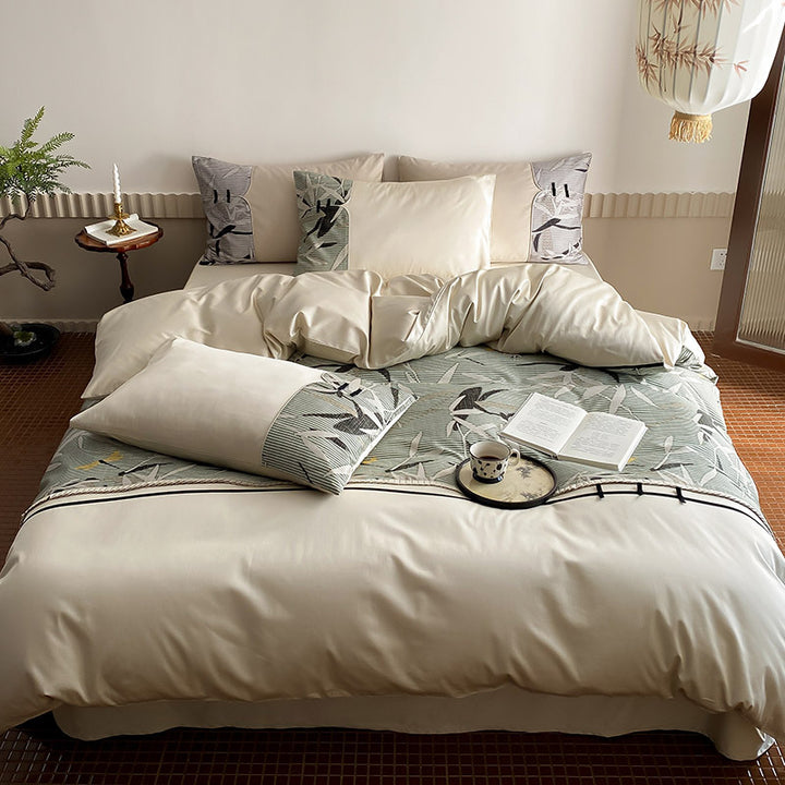 Reversible satin bedding set with quilted décor and botanical bamboo print