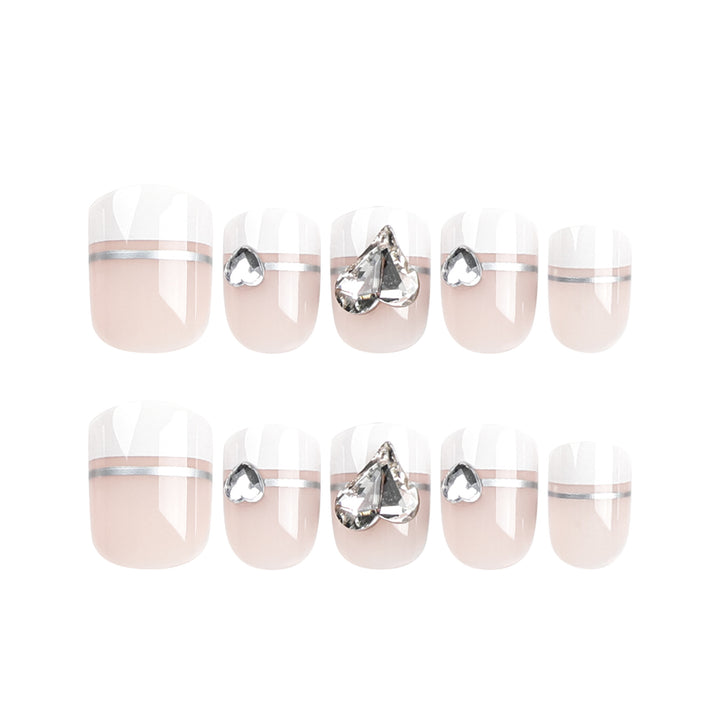 Elegant Nail Art with Glitter Accents and Jewelry Details Kalsten