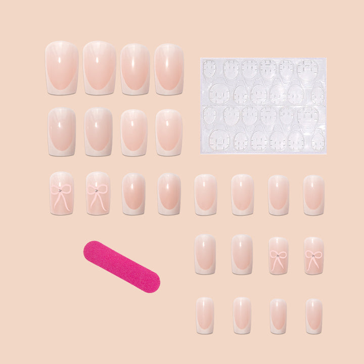 Nail art set with elegant bow and glitter accents Kalsten