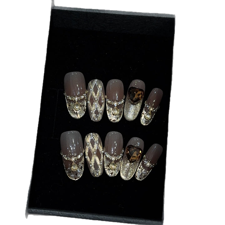 Glamorous artificial nails with glitter and heart design Kalsten