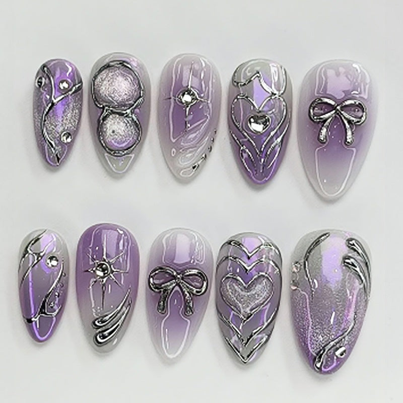Acrylic nail set with elegant ombre design and delicate embellishments Kalsten