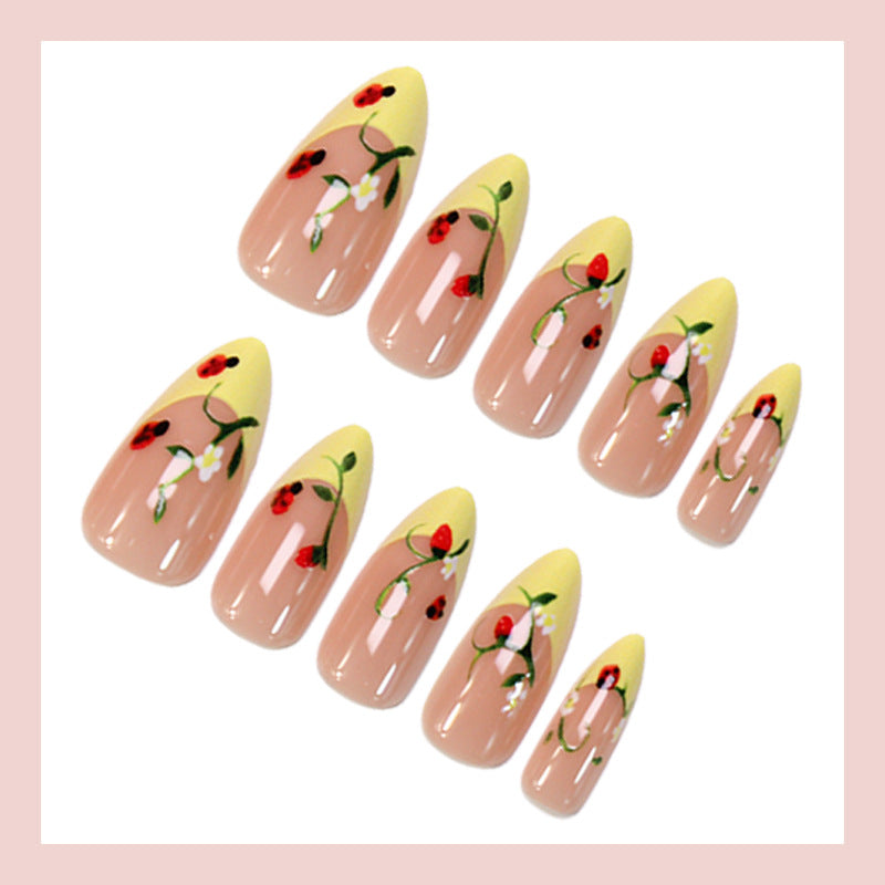 Artificial nail set with elegant gradient and floral accents Kalsten