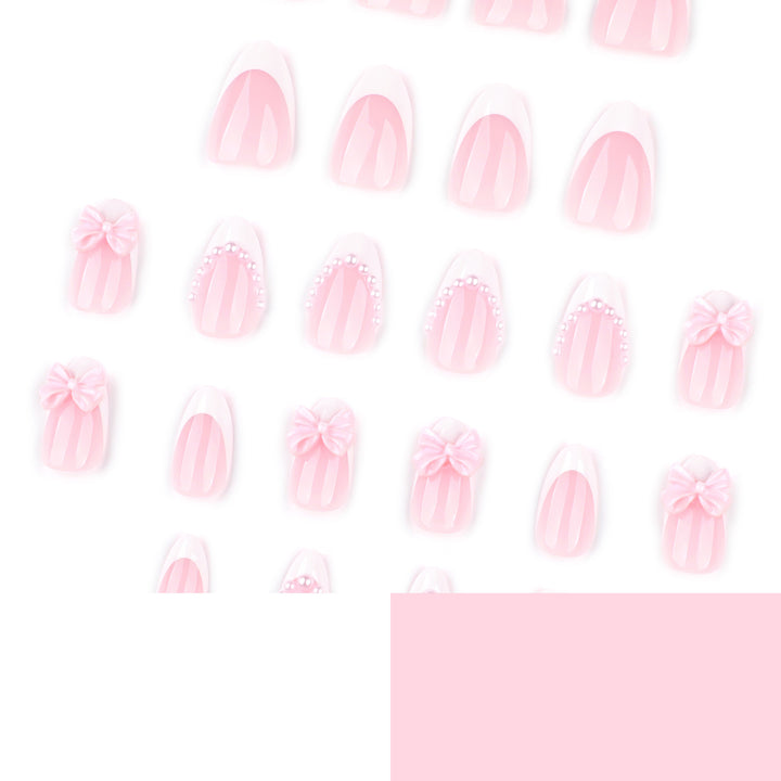 Artful Stiletto Nails with Delicate Bow Accents Kalsten