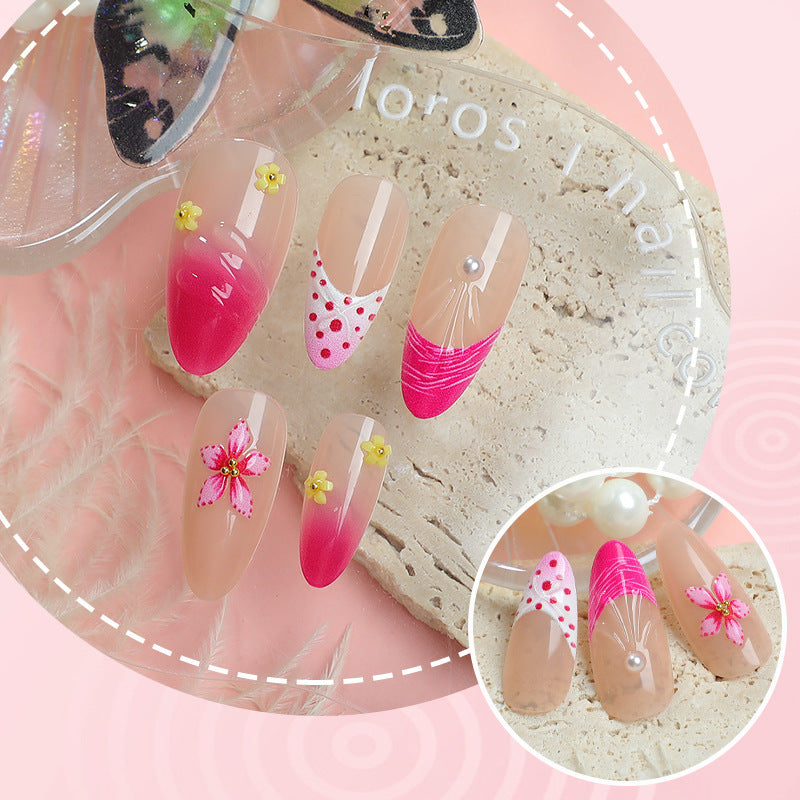 Artful nail tips with delicate floral embellishments Kalsten