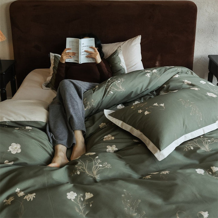Cotton satin bedding set with subtle botanical print and contrasting hem edge
