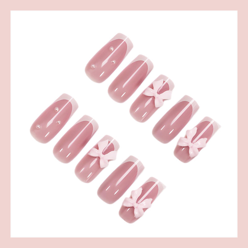 Nail art set with playful ribbon designs and elegant accents Kalsten