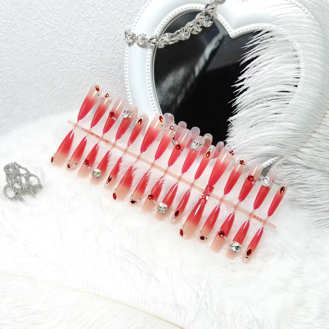 Artificial nails with glamorous glitter and rhinestone embellishments Kalsten