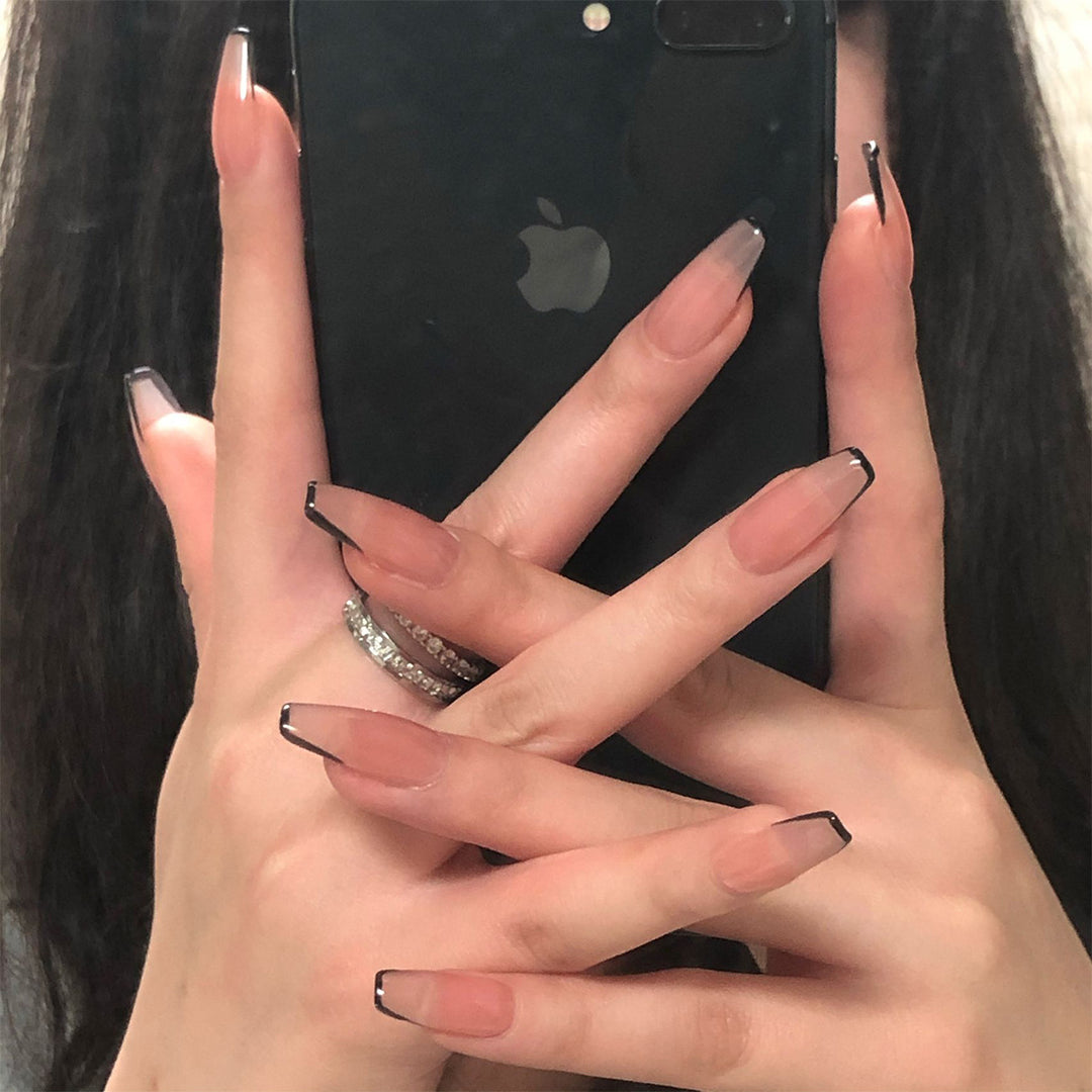 Artful stiletto nails with elegant black tip decoration Kalsten