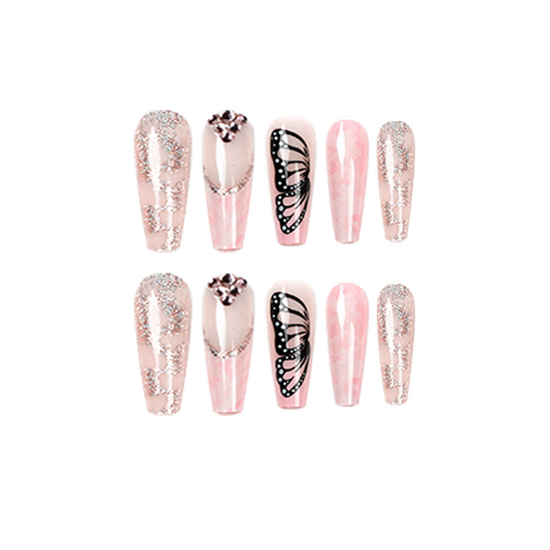 Glamorous nail extensions with beautiful butterfly motifs and glitter accents Kalsten