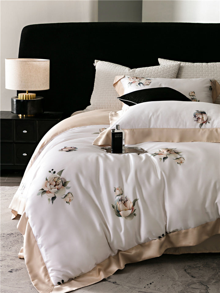 Duvet cover set made of cotton satin with subtle watercolor flower print and silky-matte texture