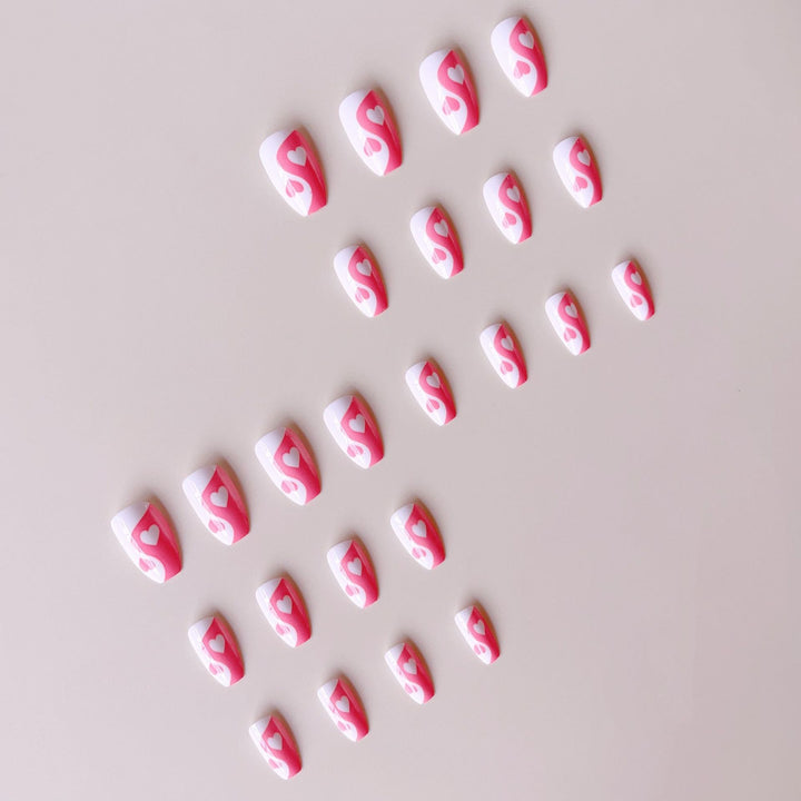 Artificial nails with heart motif and floral accents Kalsten