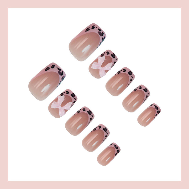 Acrylic nail set with playful bows and modern accents Kalsten