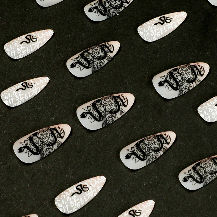 Artful nail extensions in elegant stiletto style with artistic floral and graphic designs Kalsten