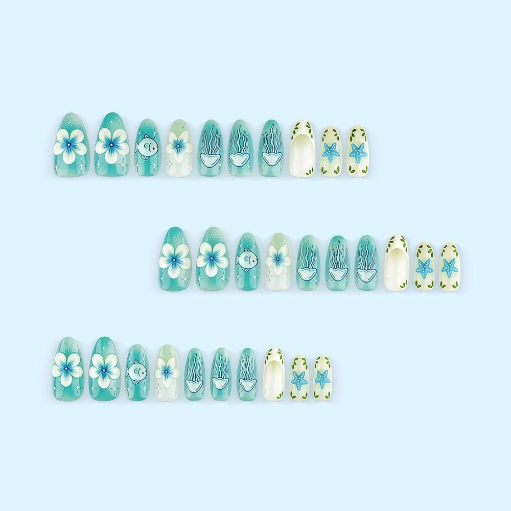 Artificial nails in a maritime design with colorful shell and water motifs Kalsten