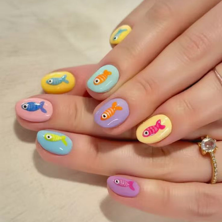 Creative artificial nails with playful fish design Kalsten