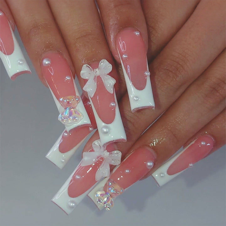 Artificial nail set with elegant 3D bows and glitter accents Kalsten