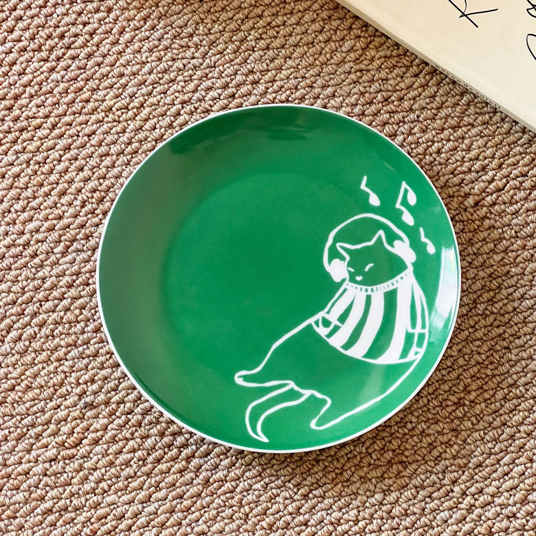 Handcrafted ceramic plate with illustrative cat design