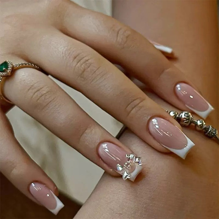 Artificial nail set with glamorous French tips and sparkling accents Kalsten