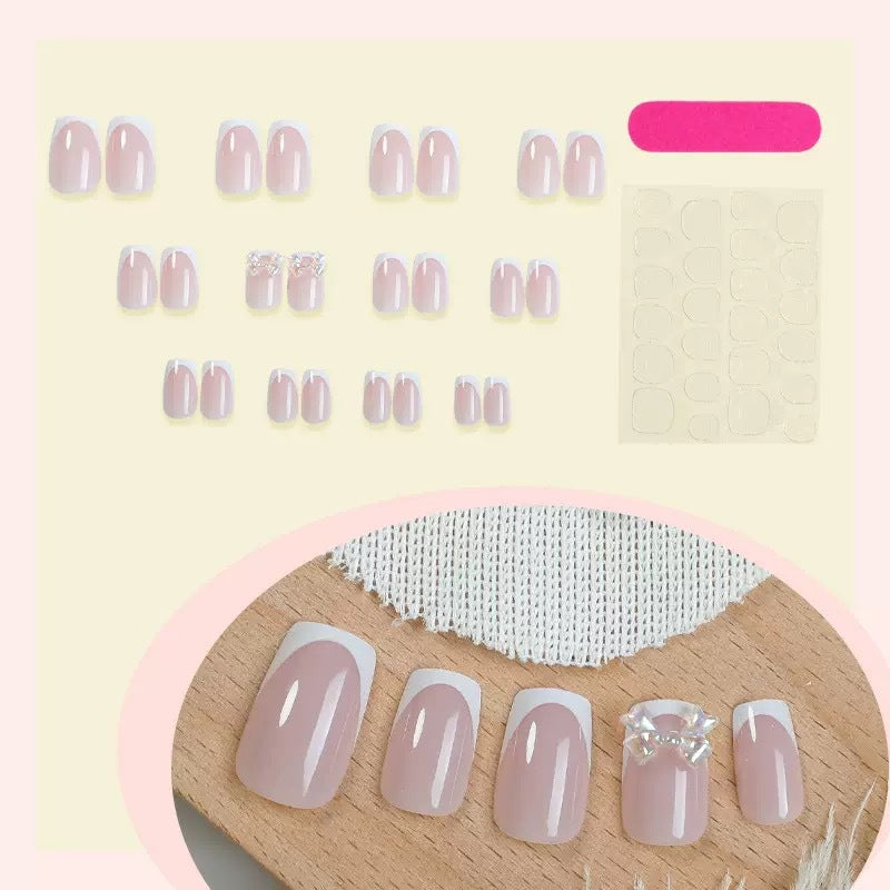 Artificial nail set with glamorous French tips and sparkling accents Kalsten