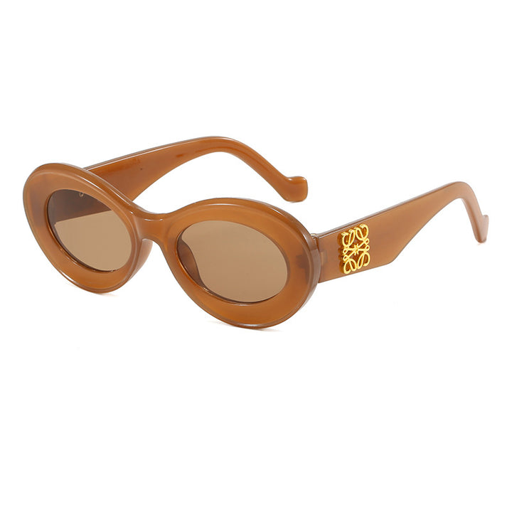 Women's fashionable sunglasses with oval frame and golden applications Kalsten