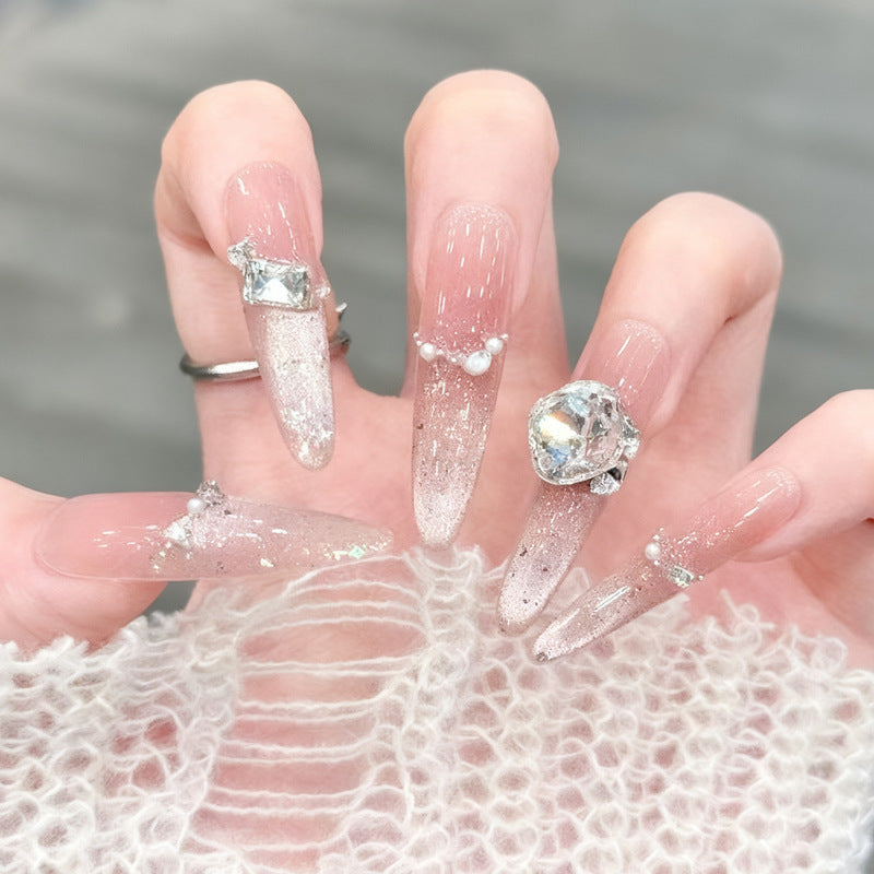 Glamorous artificial nails with creative embellishments Kalsten