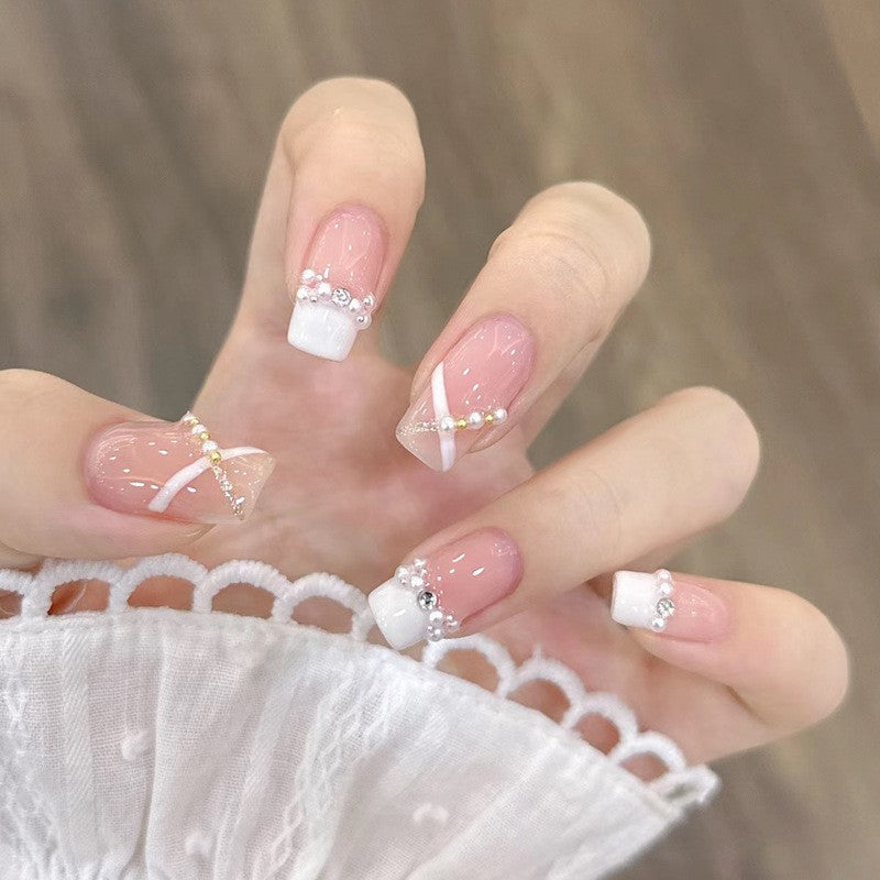 Artificial nails with heart design and glamorous accents Kalsten