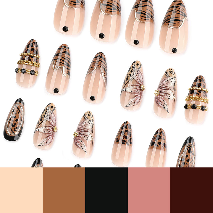 Artful stiletto nail with floral accents and gold embellishments Kalsten