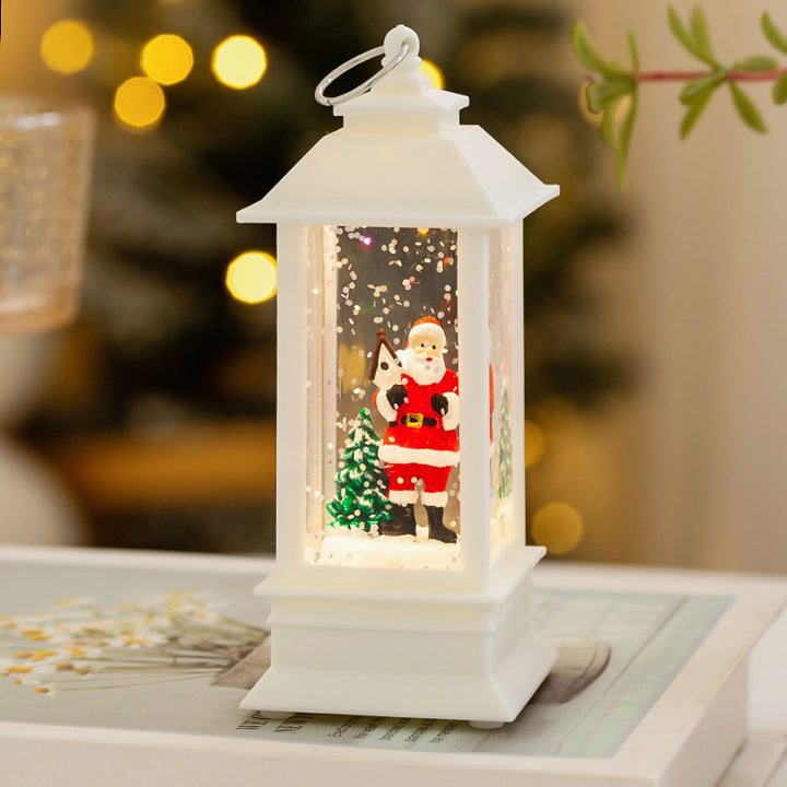 Christmas lantern with LED lighting and decorative snow effect